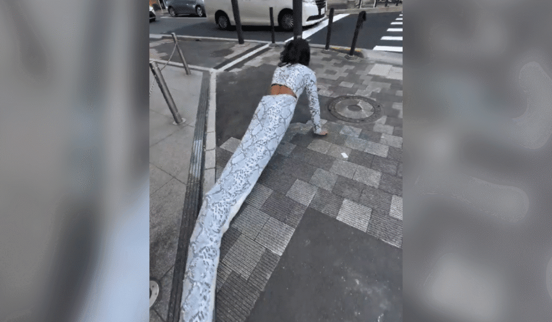 Brazilian influencer Dresses Up as a Snake and Crawls through the Streets of Japan Scaring Residents