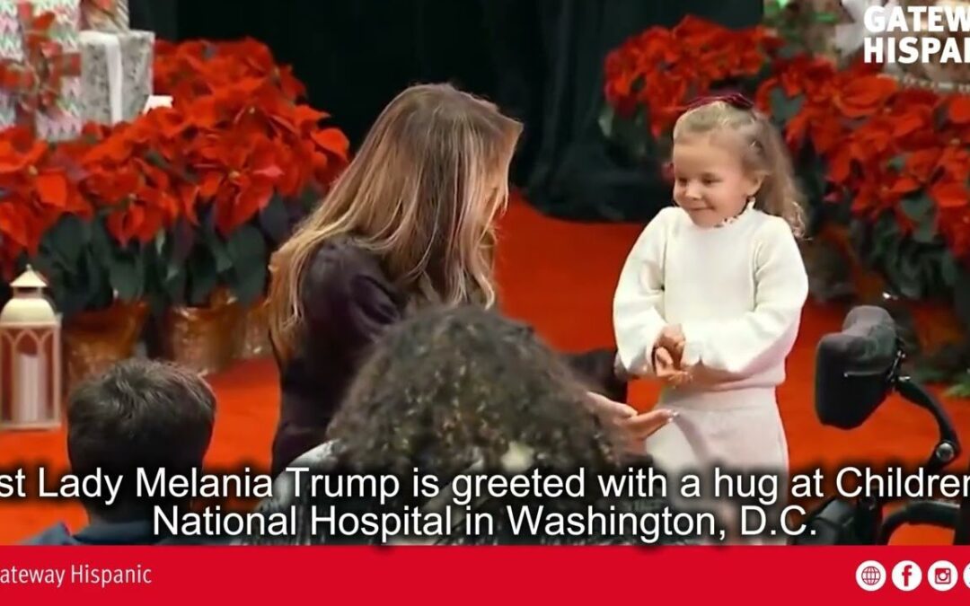 First Lady Melania Trump is greeted with a hug at Children’s National Hospital in Washington, DC